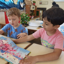 Kanha sharing his book with Jamie.