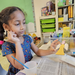 Painting our Giving tree ornaments.