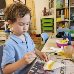 Wilbur painting a gold Angel.