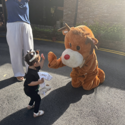 Giving a high five to our Rain Trees Reindeer. 