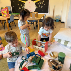 Having fun at Santa’s workshop with boxes, cans and ribbons!