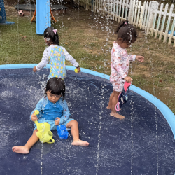 Sara, Lulu and Imaan enjoying the sprinklers!