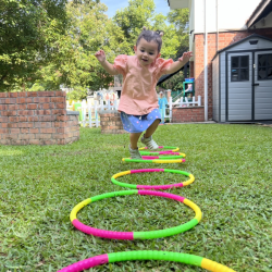 Skyla jumping in and out of hula hoops!