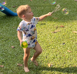 Archer popping bubbles with a whisk!