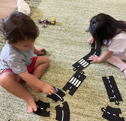 Ellie and Otto working together to make a road track
