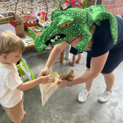 Leo busy buying his book and toy from a crocodile!