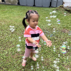 Annie popping bubbles!