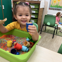 Fun with sensory rice scoop!