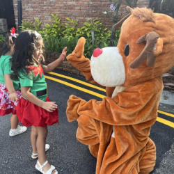 Kainaat giving a high five to our Rain Trees reindeer. 