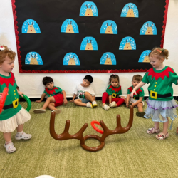 Kate and Tilly having fun with reindeer antler ring toss game.