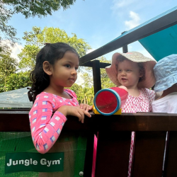 Ruhi and Tilly having fun with pretend play on the pirate ship.