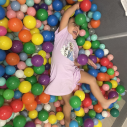 Zaya loves playing in the colourful balls.