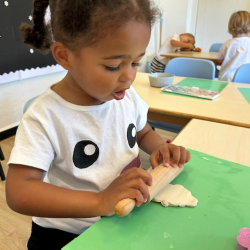 Amara is working on her Christmas clay ornament!