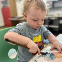 Arthur exploring colours with water colour paint!
