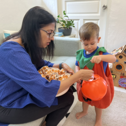 Jasper filling his pumpkin bucket with stickers!