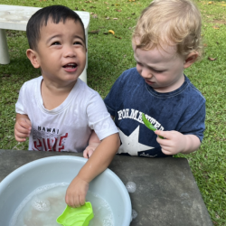 Mateo & Arthur enjoying water & sand play.