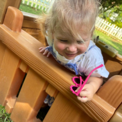 Olivia having fun in the playhouse!