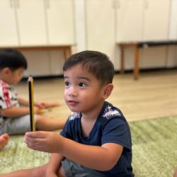 Mateo picking a pencil during our alphabet soup game!